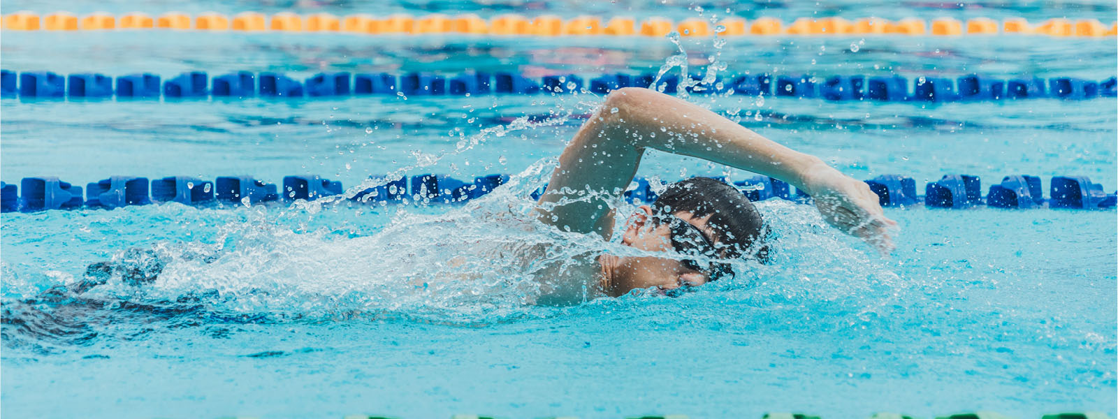 Man swimming laps in pool