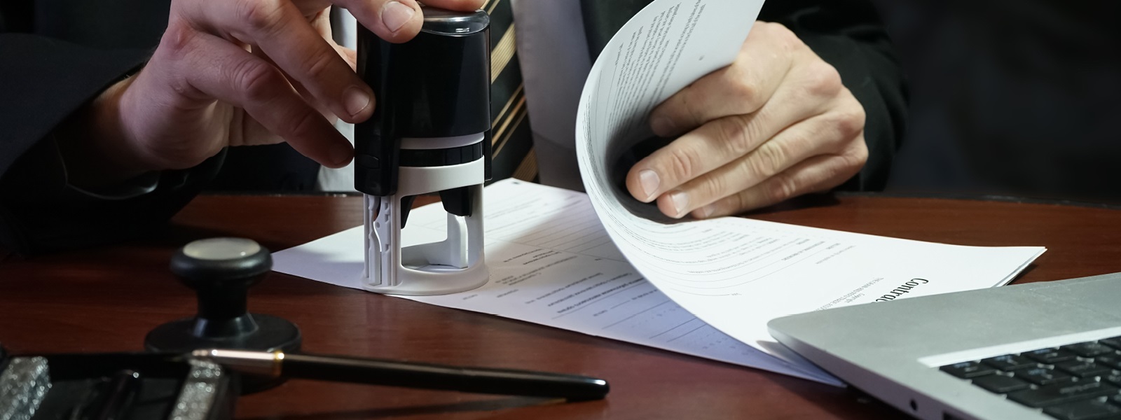 Business_man_stamping_a_document.jpg