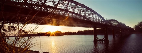 Burnett traffic bridge over Burnett river at sunset